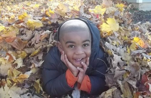 Jordan Playing in the Leaves, photo by Dad